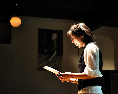 Larissa Min reading a creative nonfiction manuscript at Halo, in the Capitol HIll neighborhood of Seattle.